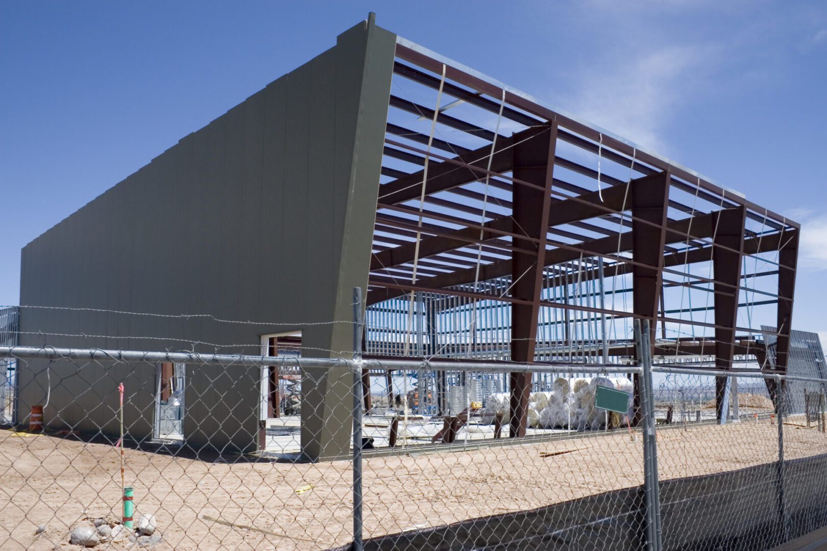 Building under construction with metal framework.